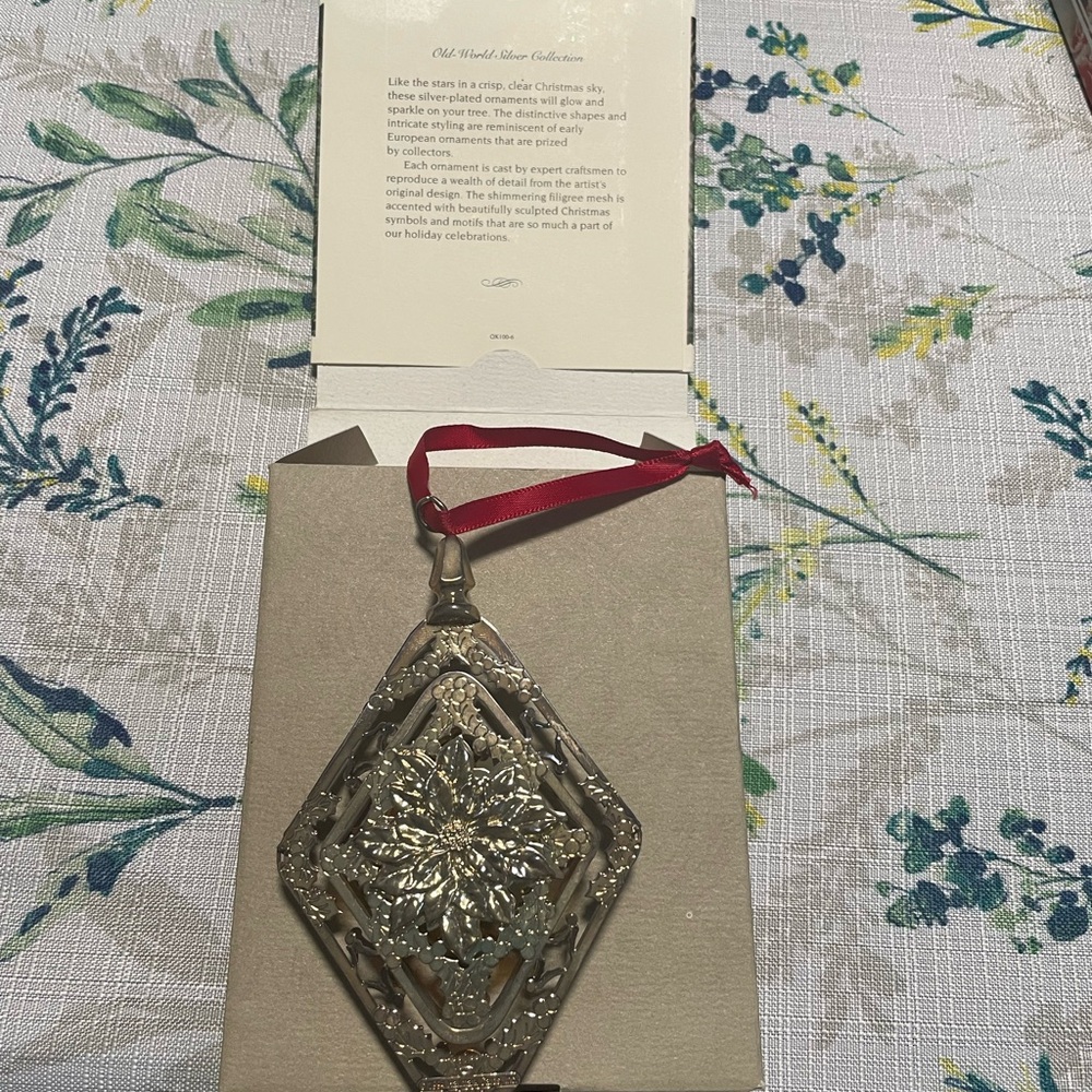 Hallmark keepsake silver loinsettia ornament.
